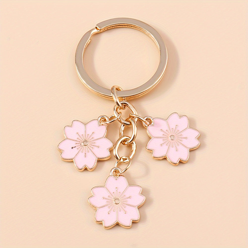 Chic Sakura Cherry Blossom Keychain - Fashionable Zinc Alloy Flower Charm for Handbags & Keys, Perfect Valentine's Gift for Her, Available in Multiple Colors