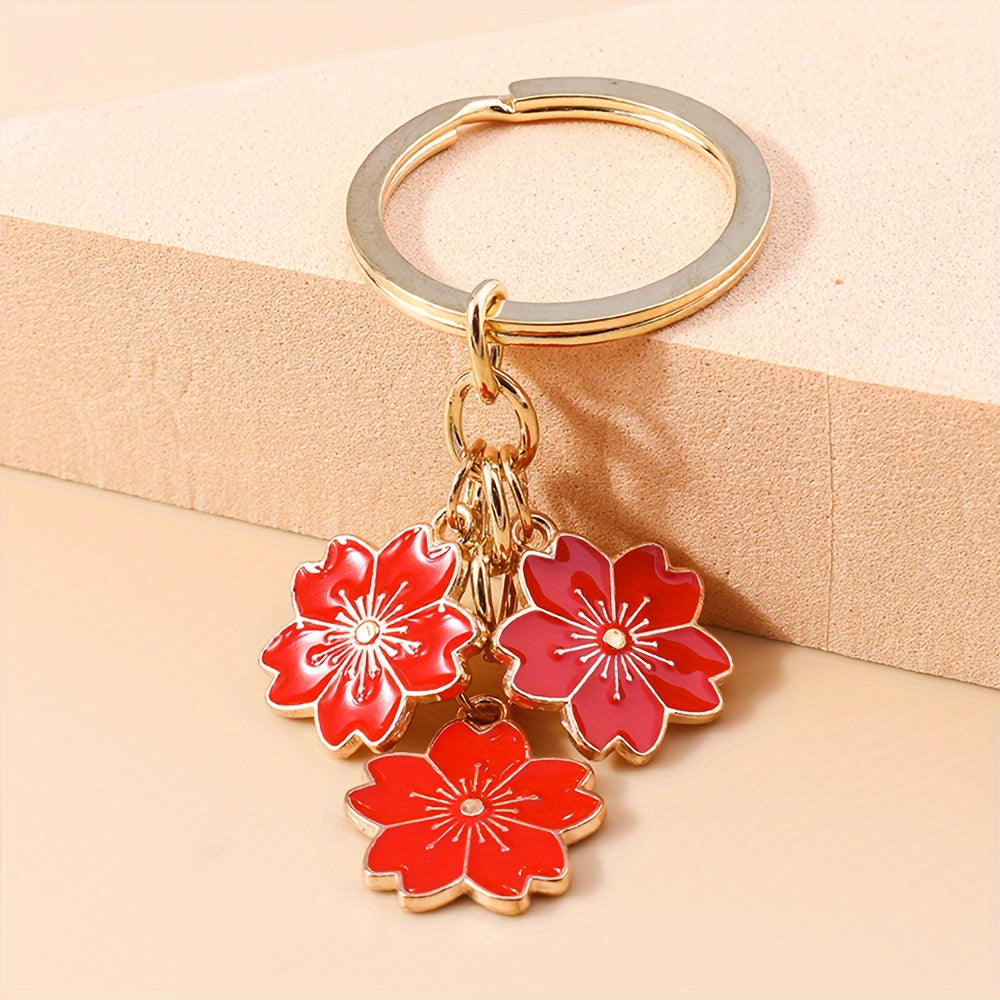 Chic Sakura Cherry Blossom Keychain - Fashionable Zinc Alloy Flower Charm for Handbags & Keys, Perfect Valentine's Gift for Her, Available in Multiple Colors