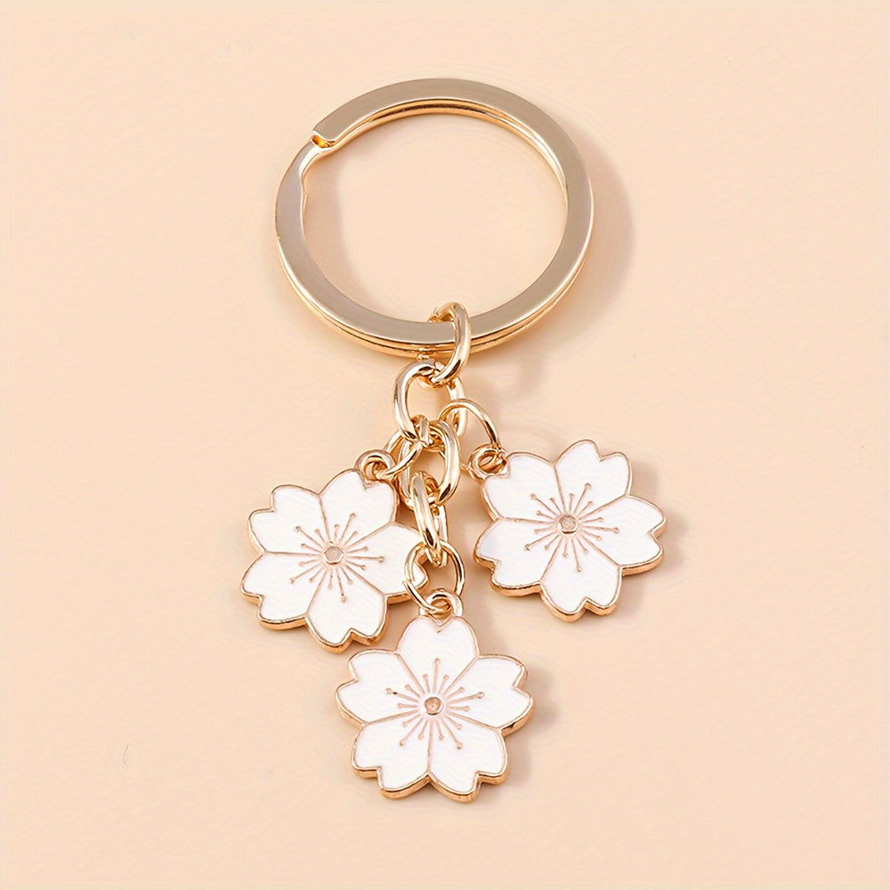 Chic Sakura Cherry Blossom Keychain - Fashionable Zinc Alloy Flower Charm for Handbags & Keys, Perfect Valentine's Gift for Her, Available in Multiple Colors